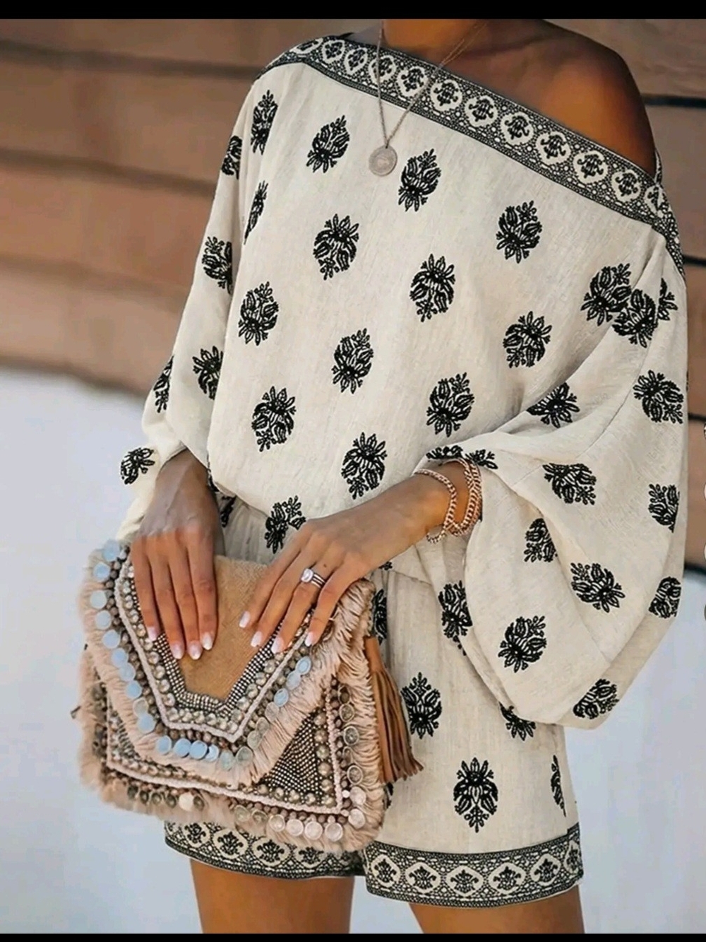 Off-Shoulder Ivory Mini Dress with Black Floral Motif